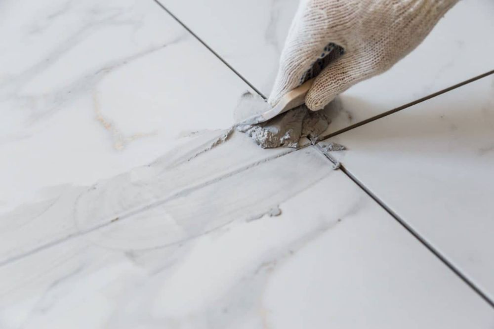 Tile joint filler and grout finish close-up.